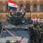 Primeiro-ministro iraquiano Ali al-Zaidi em cerimônia anunciando o fim da missão militar dos EUA no Iraque